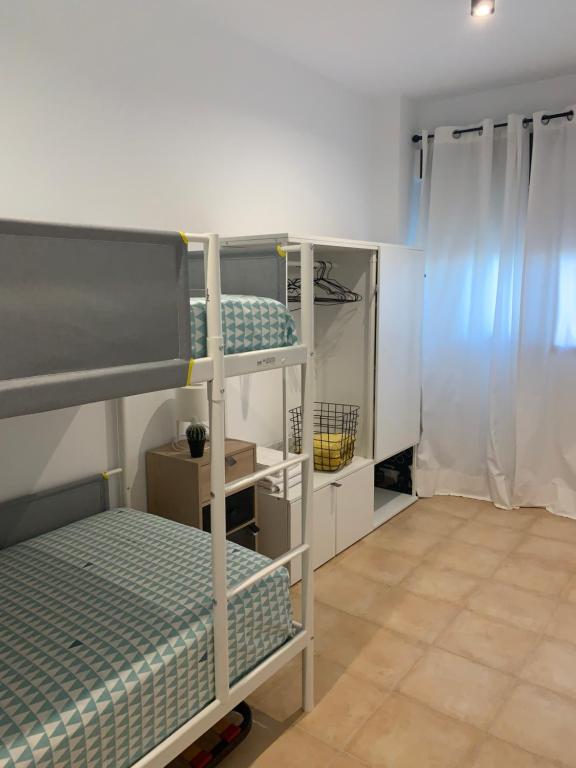 Posteľ alebo postele v izbe v ubytovaní Home Bóveda Salobreña