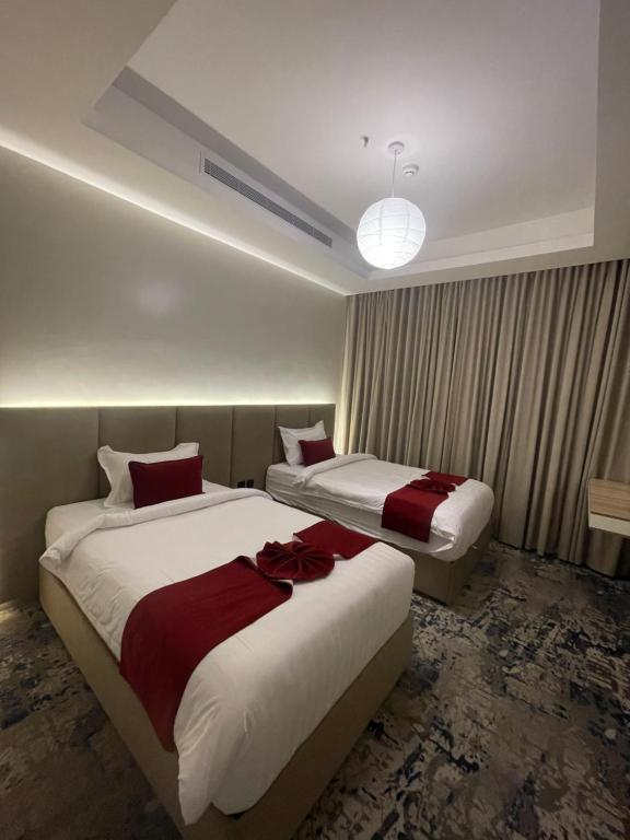 Postel nebo postele na pokoji v ubytování فندق جولدن نيو قريش - Golden New Quraish Jeddah-شركة الذهبية العصرية الفندقية