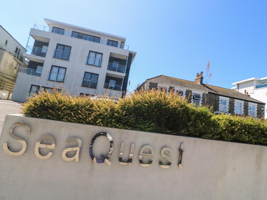 a sign for a realestate sign in front of a building at 11 Seaquest in Newquay