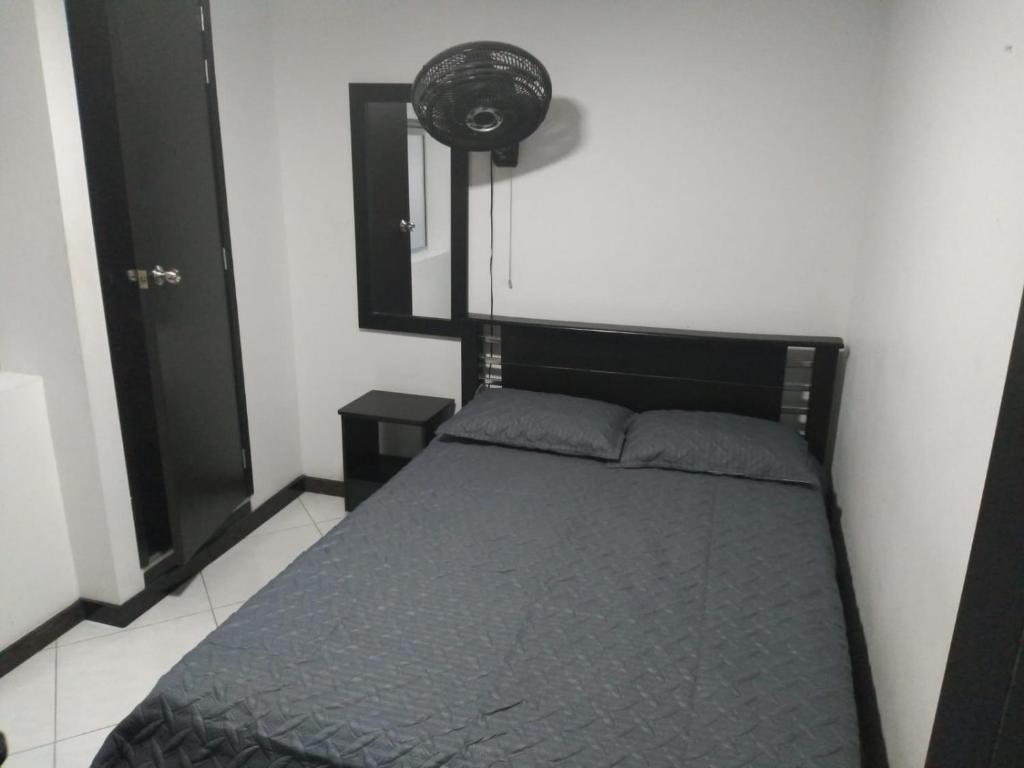 Postel nebo postele na pokoji v ubytování Hotel Murano Medellín