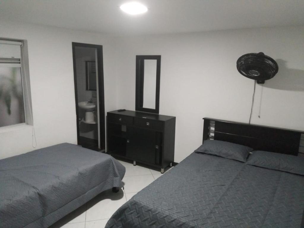 Postel nebo postele na pokoji v ubytování Hotel Murano Medellín