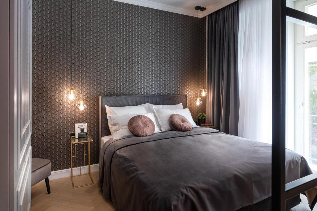 a bedroom with a bed with two pillows on it at Candy Ballerina No 2 Zagreb Center - top positon Lux in Zagreb