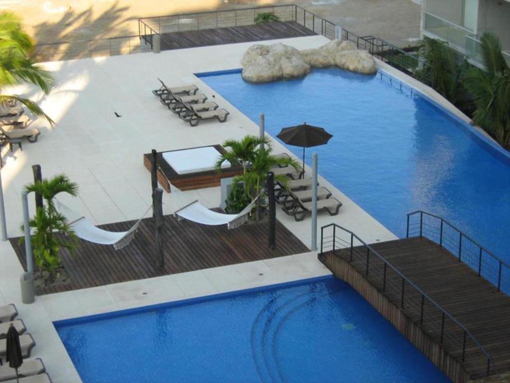 The swimming pool at or close to Apartamento Acapulco Diamante - Condominium Aura