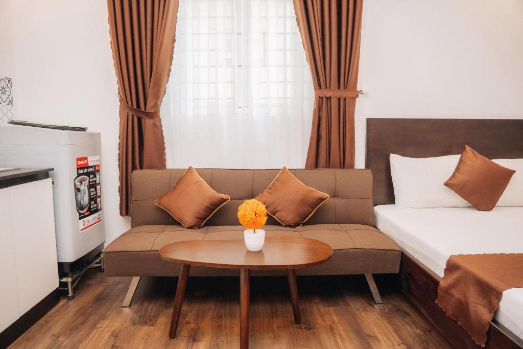 Postel nebo postele na pokoji v ubytování King Hotel Da Nang