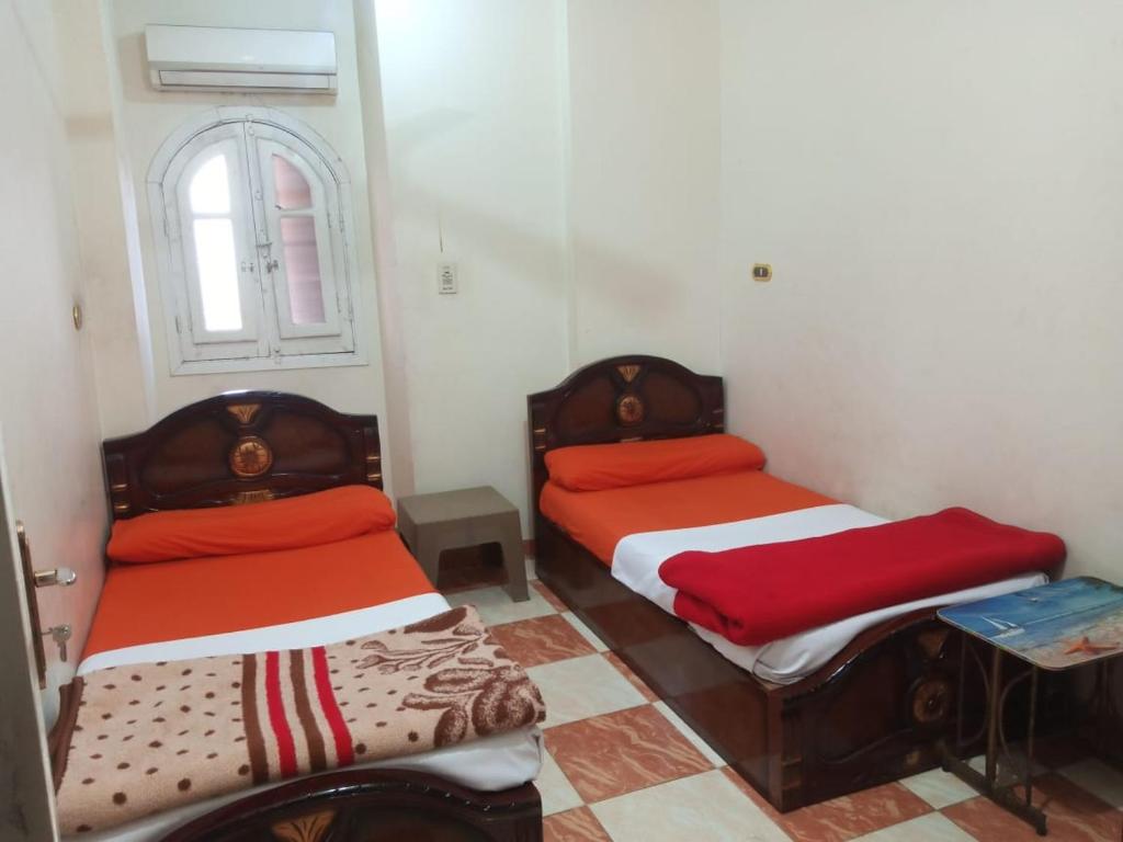 Postel nebo postele na pokoji v ubytování Aswan City Center Guest House