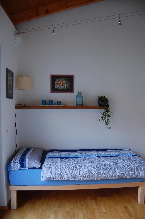 Postel nebo postele na pokoji v ubytování B&B Il Vigneto