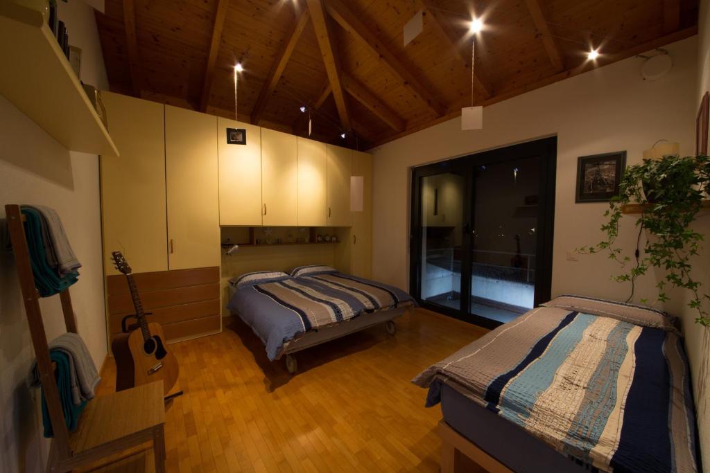 Postel nebo postele na pokoji v ubytování B&B Il Vigneto