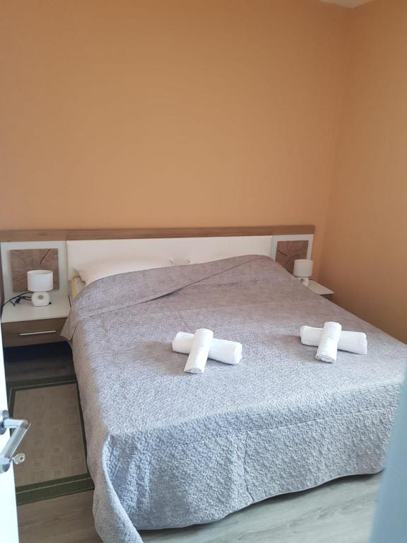 Łóżko lub łóżka w pokoju w obiekcie Apartment in Vrsi with Air conditioning, WIFI, Washing machine, Dishwasher (4836-1)