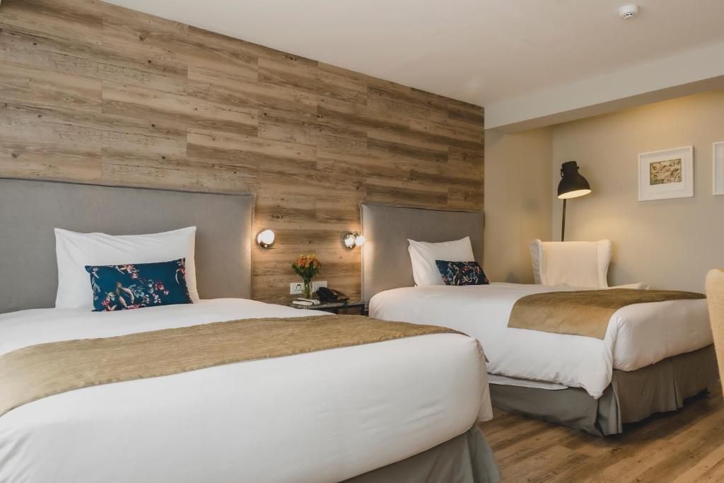 Postel nebo postele na pokoji v ubytování ARTE HOTEL Lima