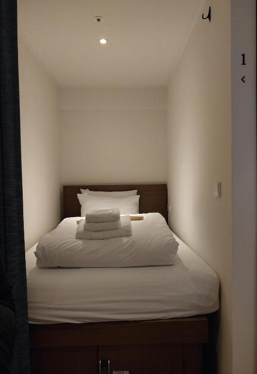 Cama ou camas em um quarto em H HOSTEL Itaewon