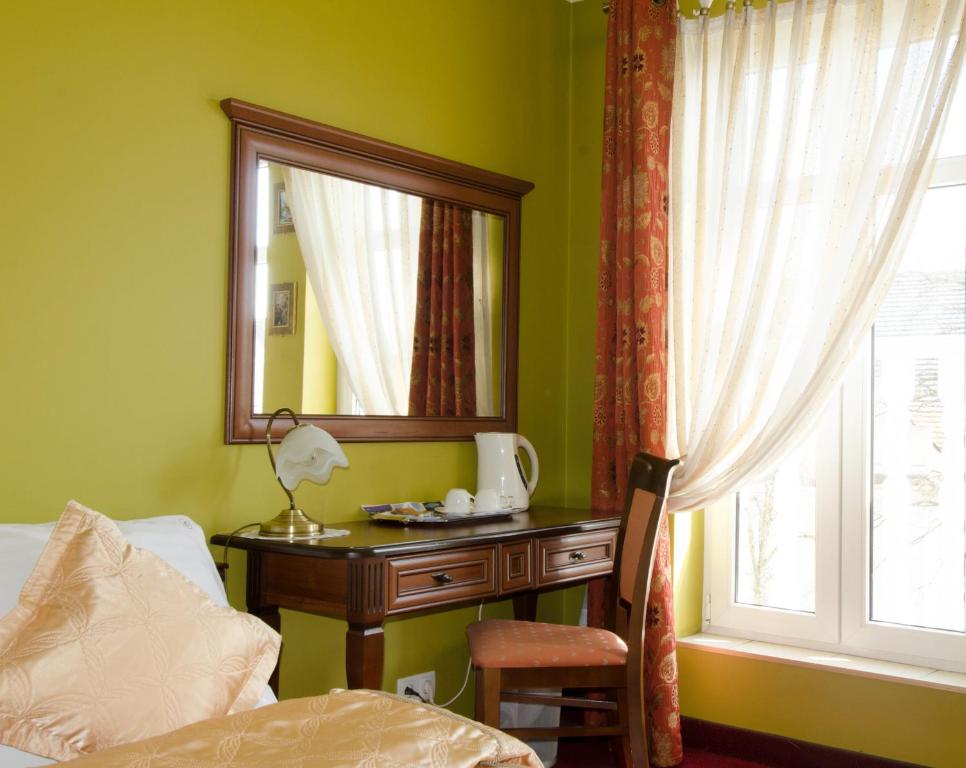 Postel nebo postele na pokoji v ubytování Hotel Atrium