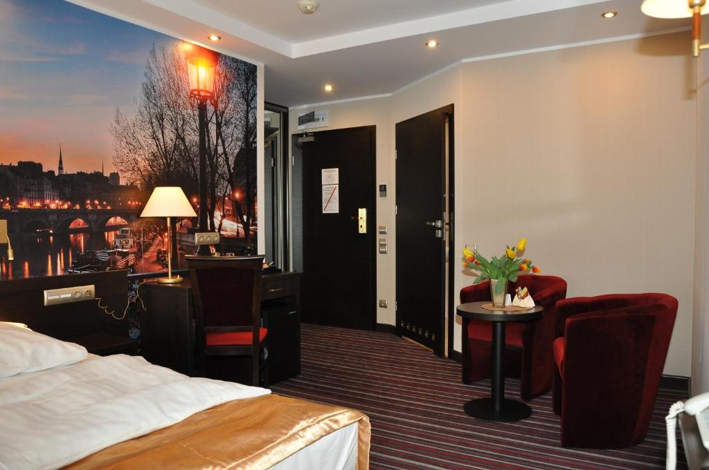Postel nebo postele na pokoji v ubytování Hotel Atrium
