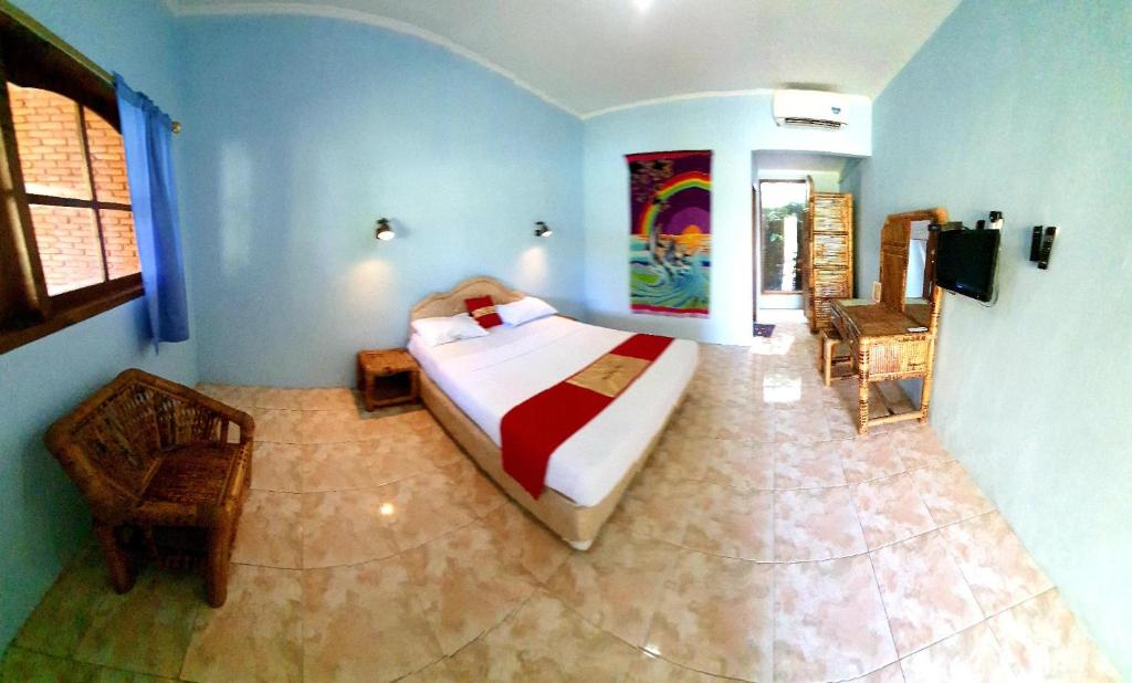 Postel nebo postele na pokoji v ubytování HOTEL BESAR BULAN BARU - Senggigi