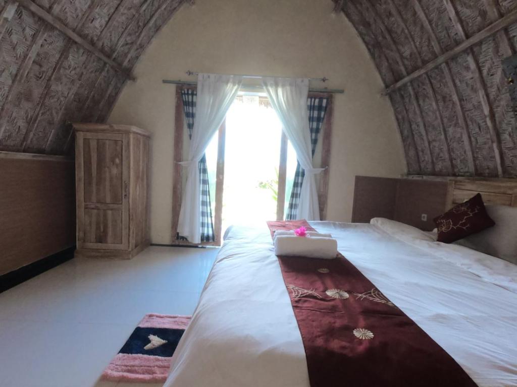 Tempat tidur dalam kamar di Penida Hills