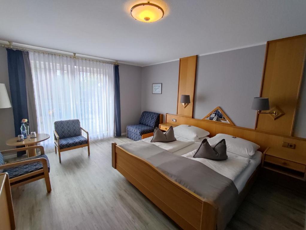 Postel nebo postele na pokoji v ubytování Hotel Zum Märchenwald