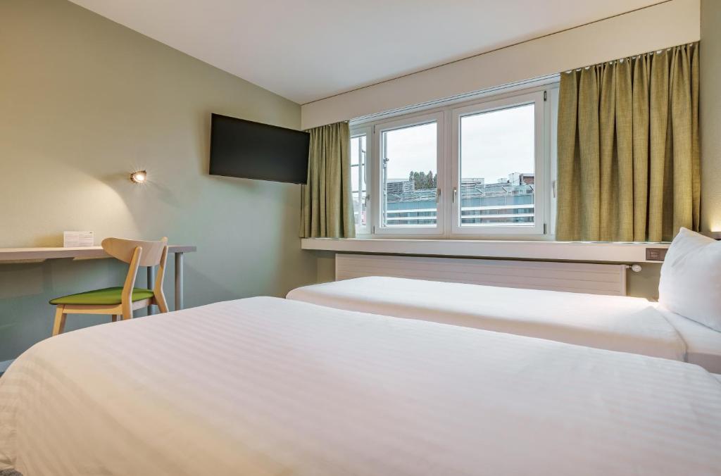 Postel nebo postele na pokoji v ubytování flexymotel Wil