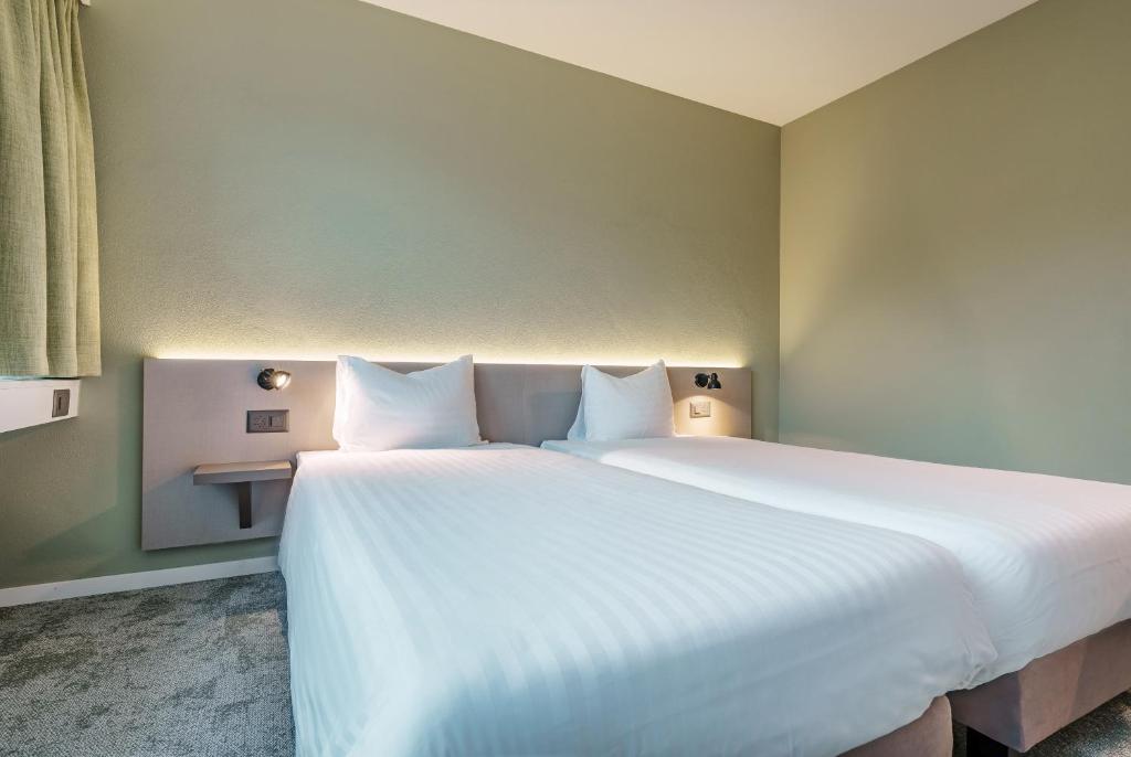 Postel nebo postele na pokoji v ubytování flexymotel Wil