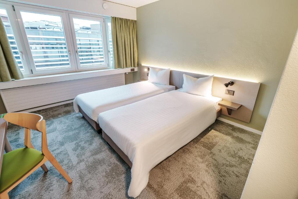 Postel nebo postele na pokoji v ubytování flexymotel Wil