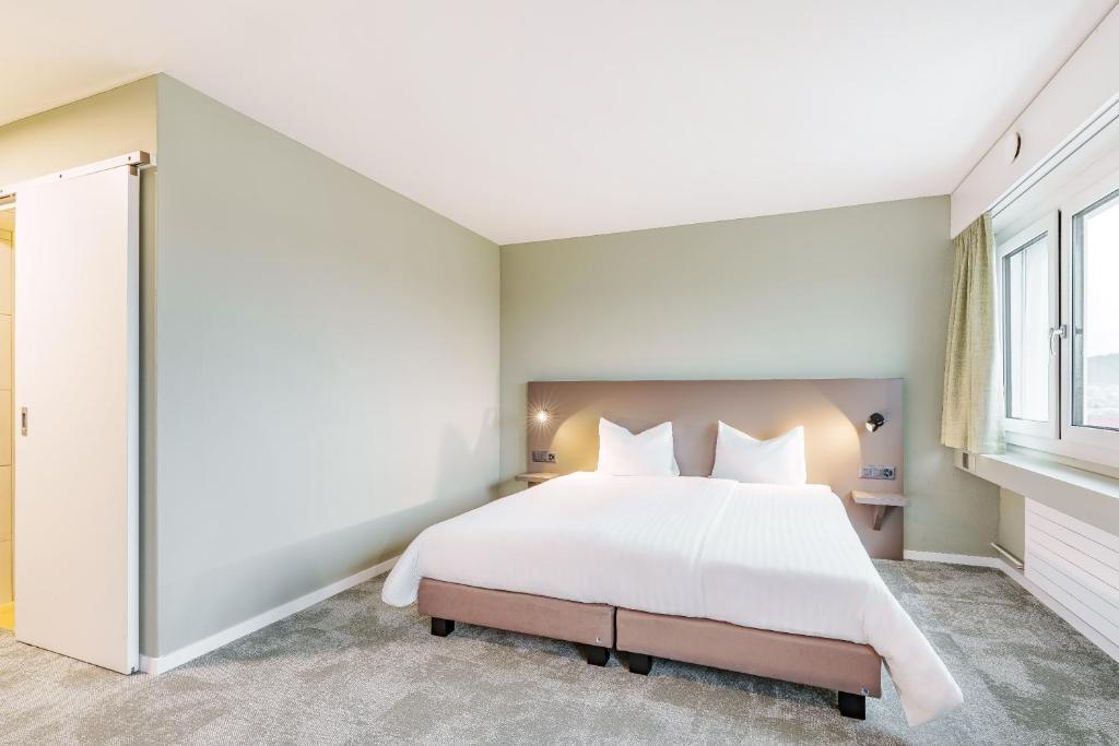 Postel nebo postele na pokoji v ubytování flexymotel Wil