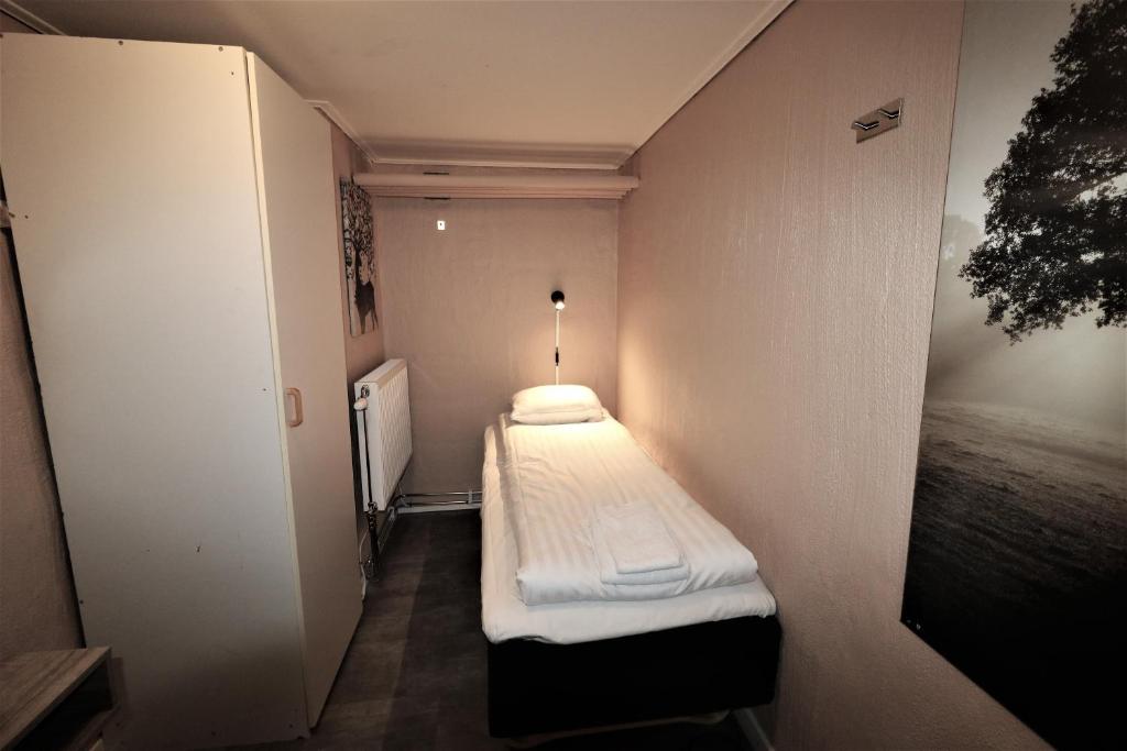 Postel nebo postele na pokoji v ubytování RIBO Apartment Arctic