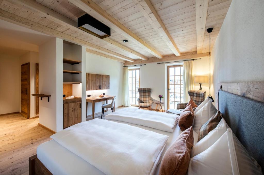 Postel nebo postele na pokoji v ubytování Hotel Grünerhof