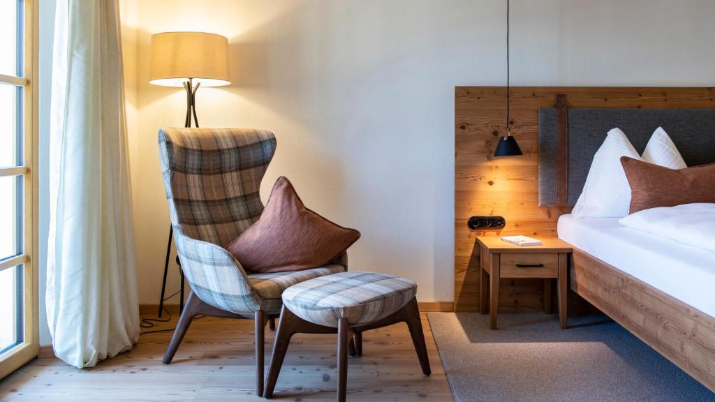 Postel nebo postele na pokoji v ubytování Hotel Grünerhof