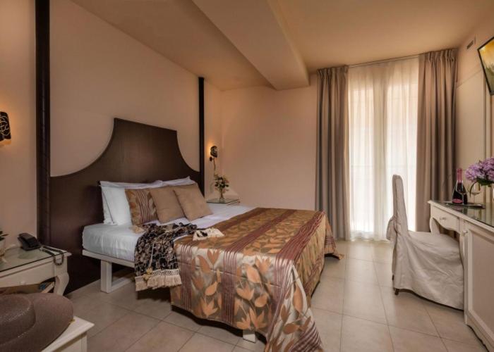 Postel nebo postele na pokoji v ubytování Baia del Mar Beach Boutique Hotel