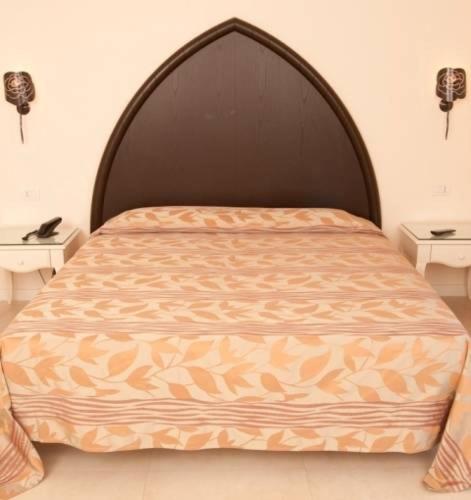 Postel nebo postele na pokoji v ubytování Baia del Mar Beach Boutique Hotel