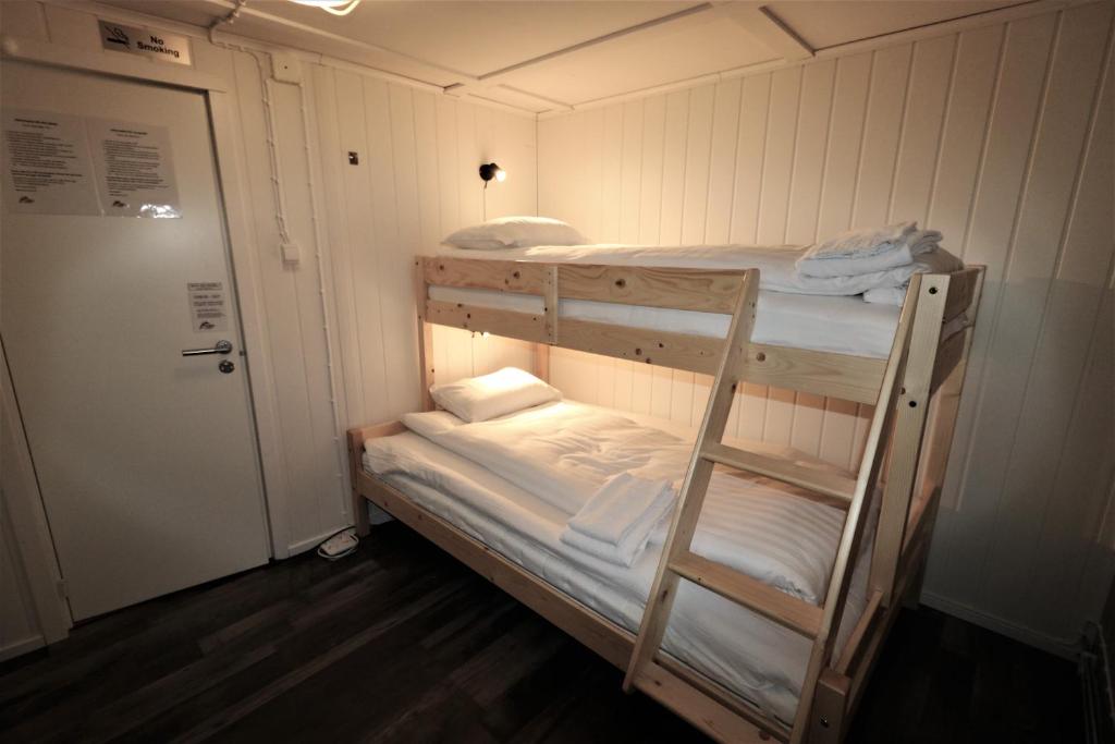 Postel nebo postele na pokoji v ubytování RIBO Apartment Arctic