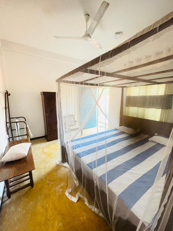 Postel nebo postele na pokoji v ubytování Chithra Homestay