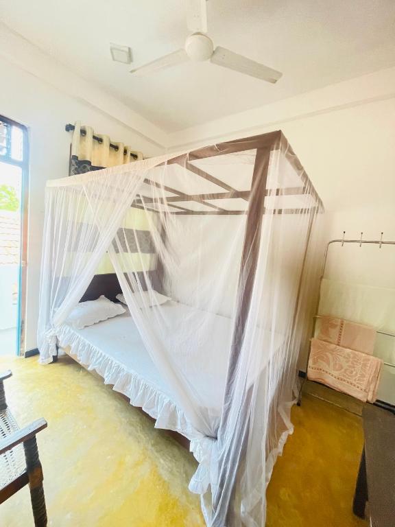 Postel nebo postele na pokoji v ubytování Chithra Homestay