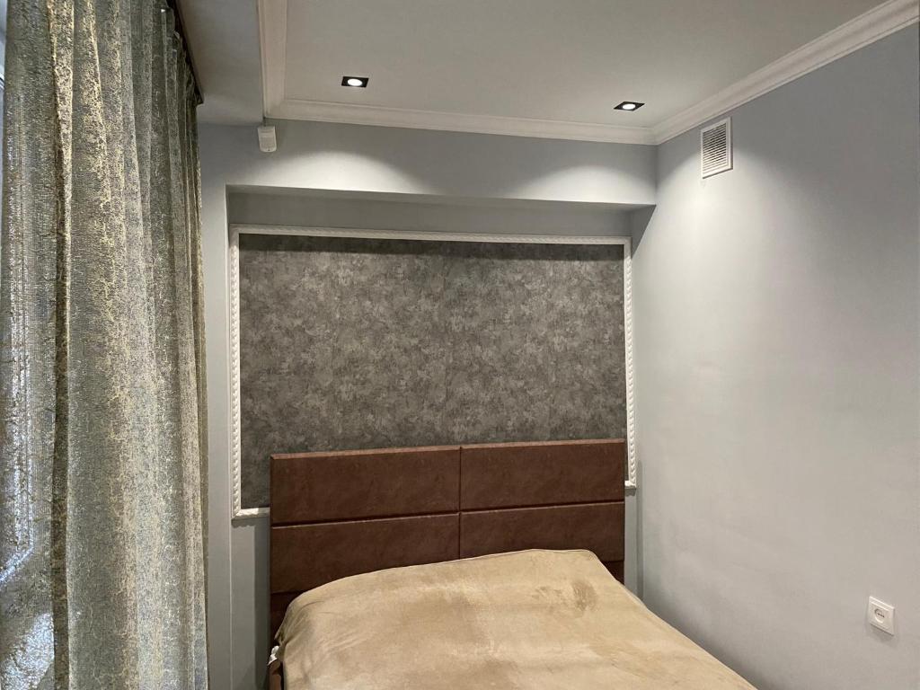 Ένα ή περισσότερα κρεβάτια σε δωμάτιο στο One Central Apartment