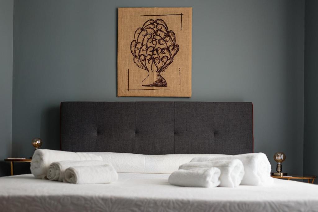 Postel nebo postele na pokoji v ubytování B&B Giardinello