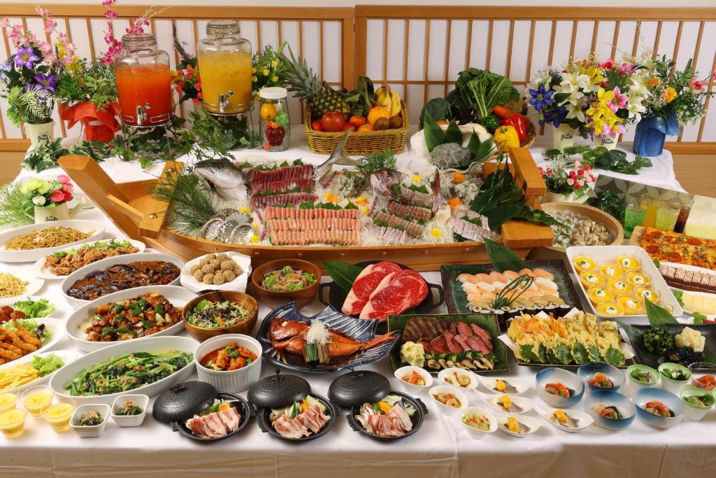 a buffet with many different types of food on a table at Wellness Forest Ito - Kyoritsu Resort in Ito