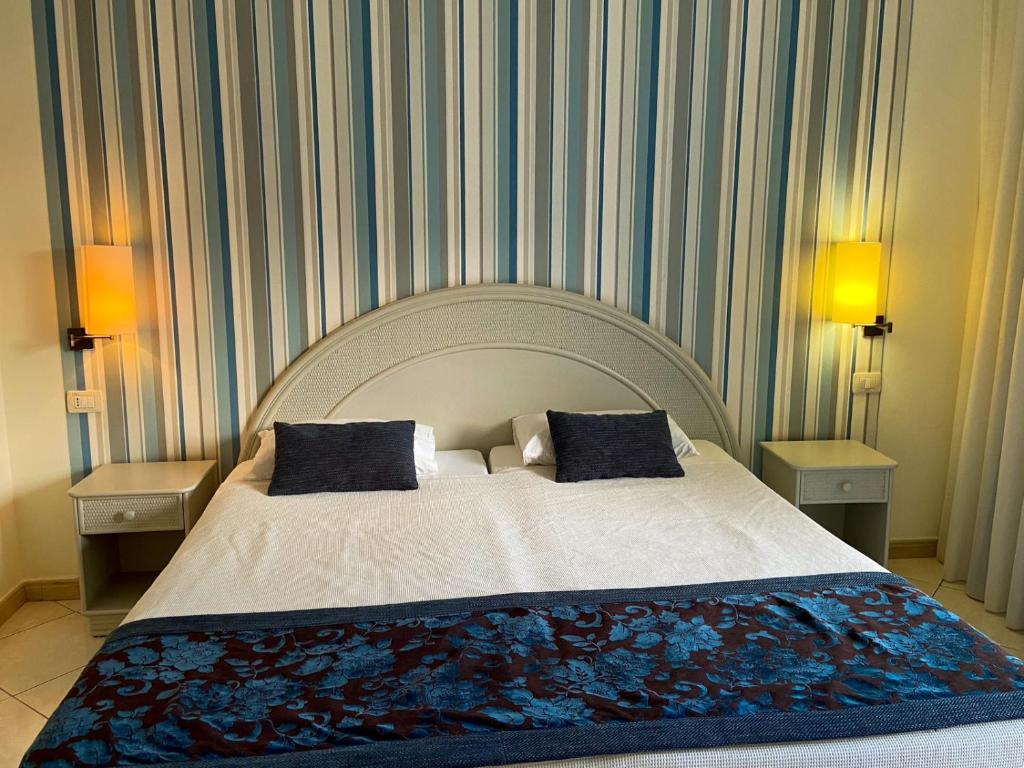 Postel nebo postele na pokoji v ubytování Ouril Pontao Hotel
