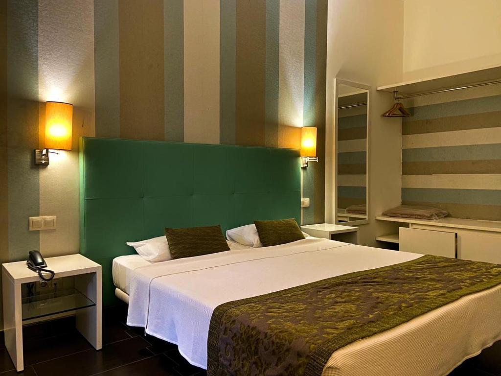 Postel nebo postele na pokoji v ubytování Ouril Pontao Hotel