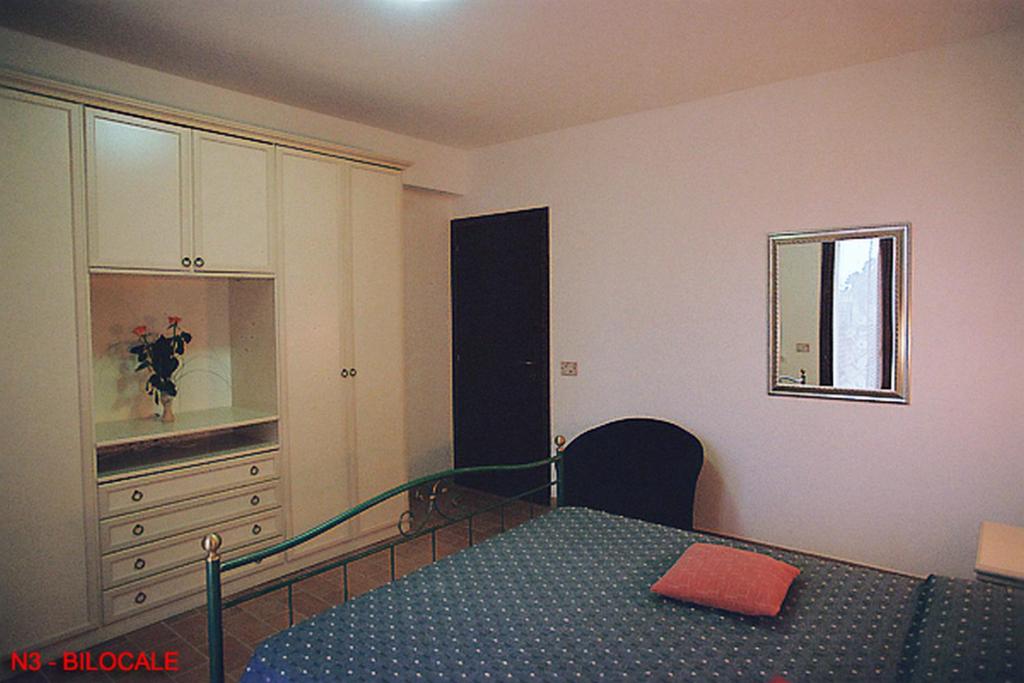 Łóżko lub łóżka w pokoju w obiekcie La casa di Carla