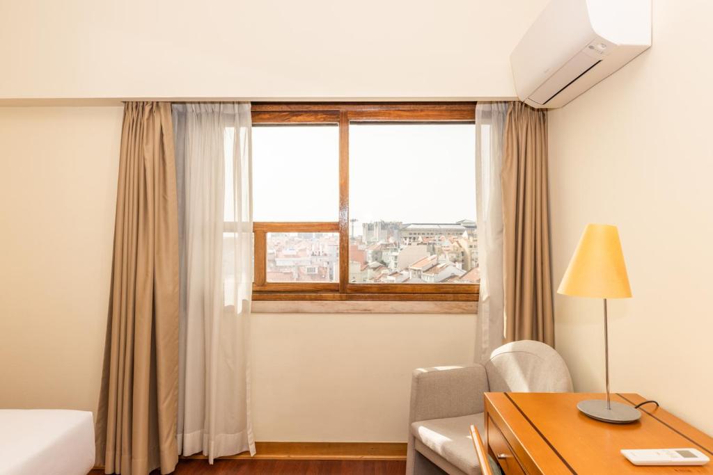 Uma área de estar em Hotel Roma