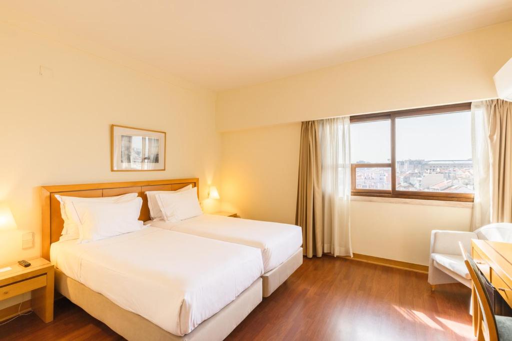 Uma cama ou camas num quarto em Hotel Roma
