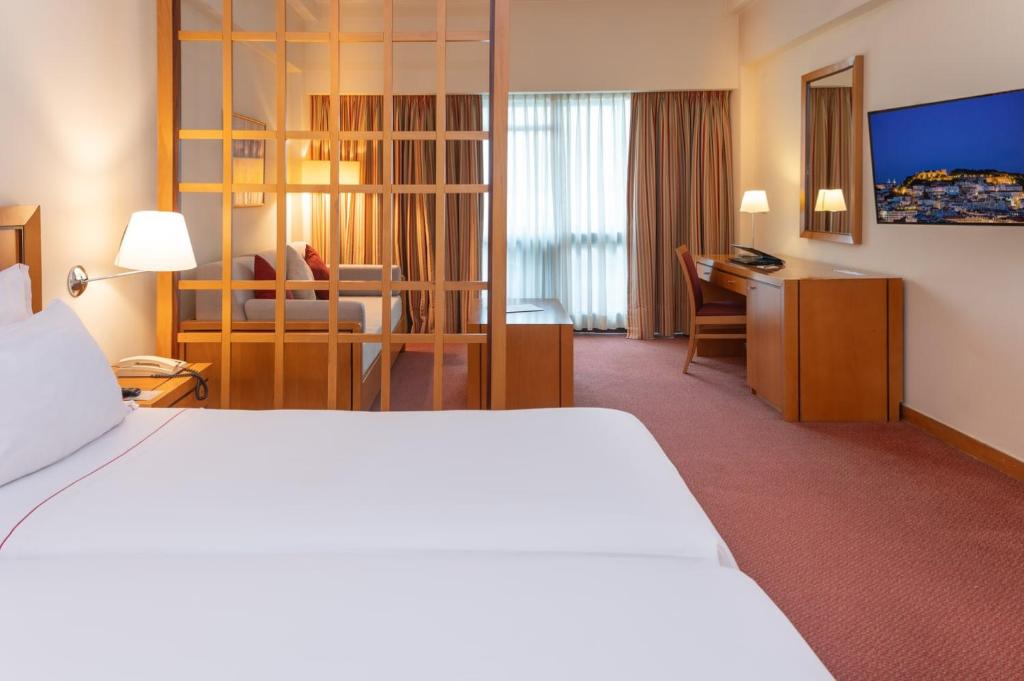 Uma cama ou camas num quarto em Hotel Roma