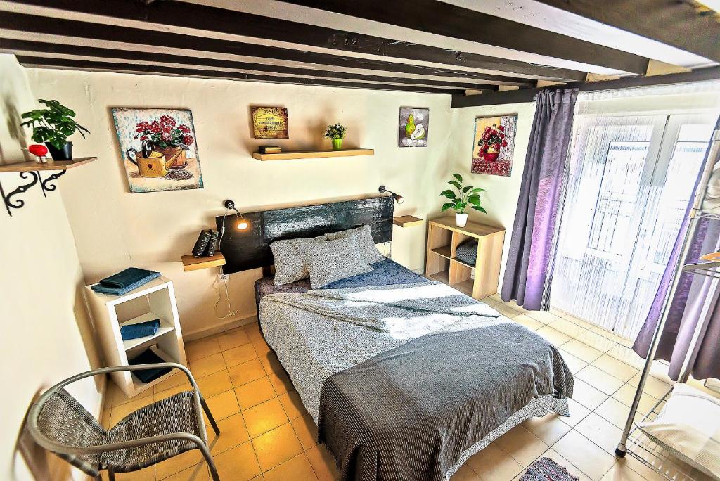 A bed or beds in a room at Milagros Central Apartments