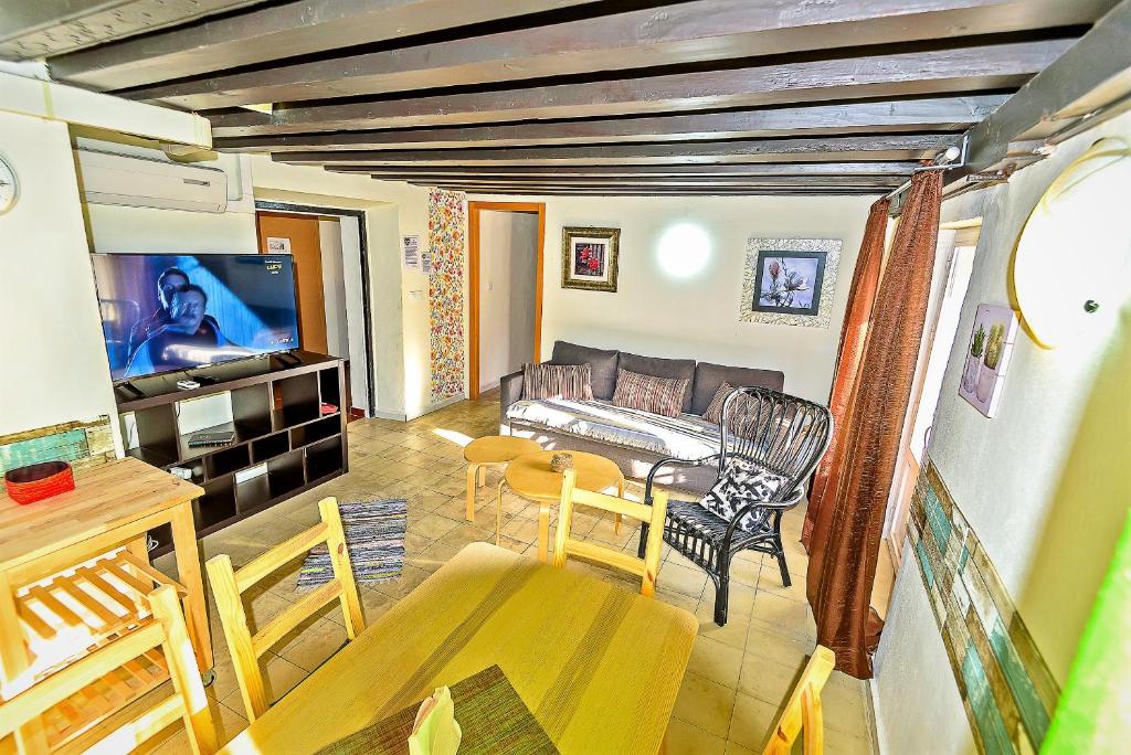 A television and/or entertainment centre at Milagros Central Apartments