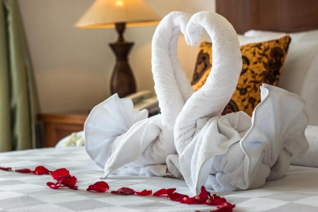Lova arba lovos apgyvendinimo įstaigoje Gita Maha Ubud Hotel by Mahaputra-CHSE Certified