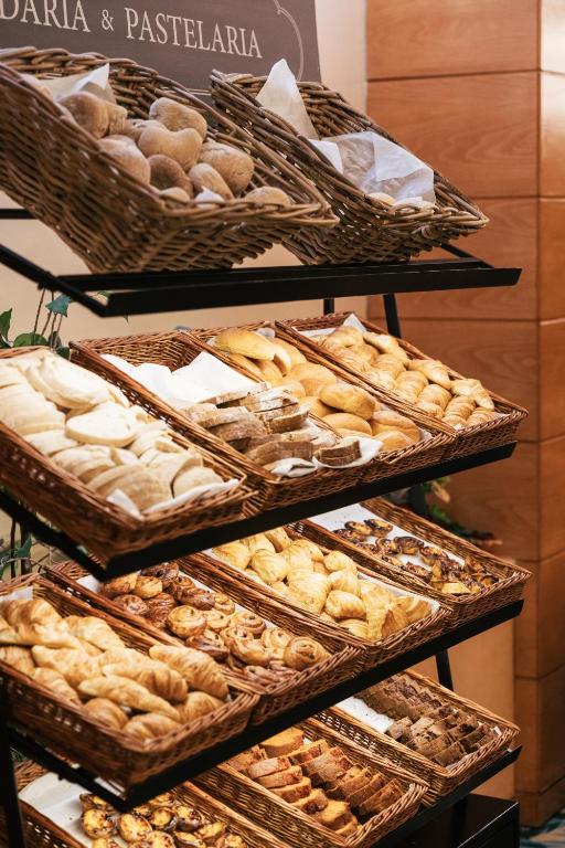 A tall pastry display offers multiple baskets of baked goods.