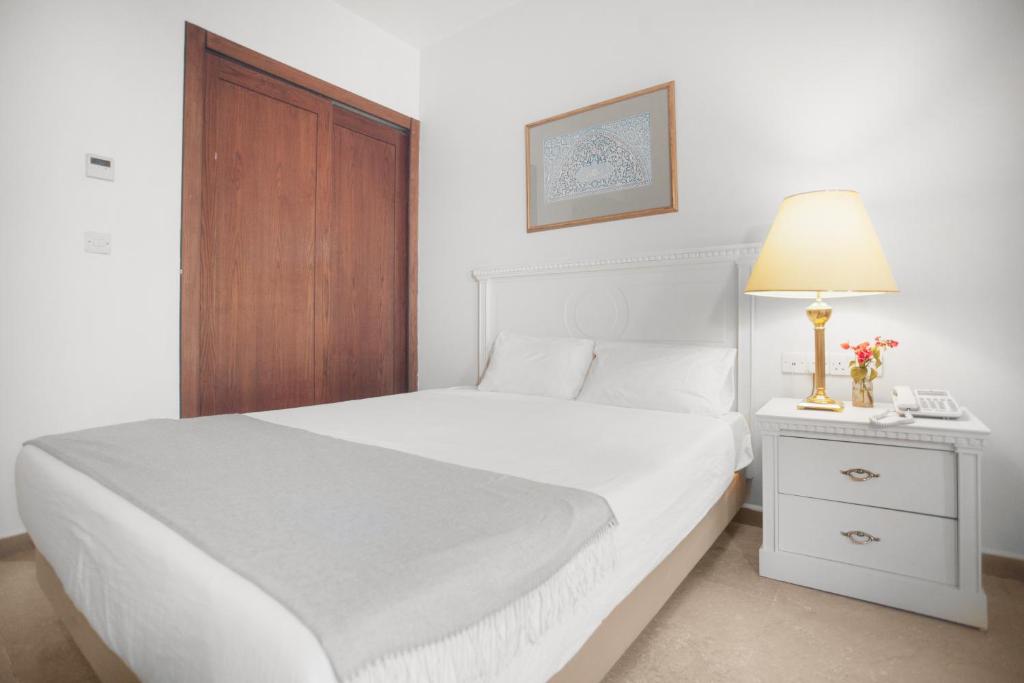 Postel nebo postele na pokoji v ubytování Grand Hotel Madaba