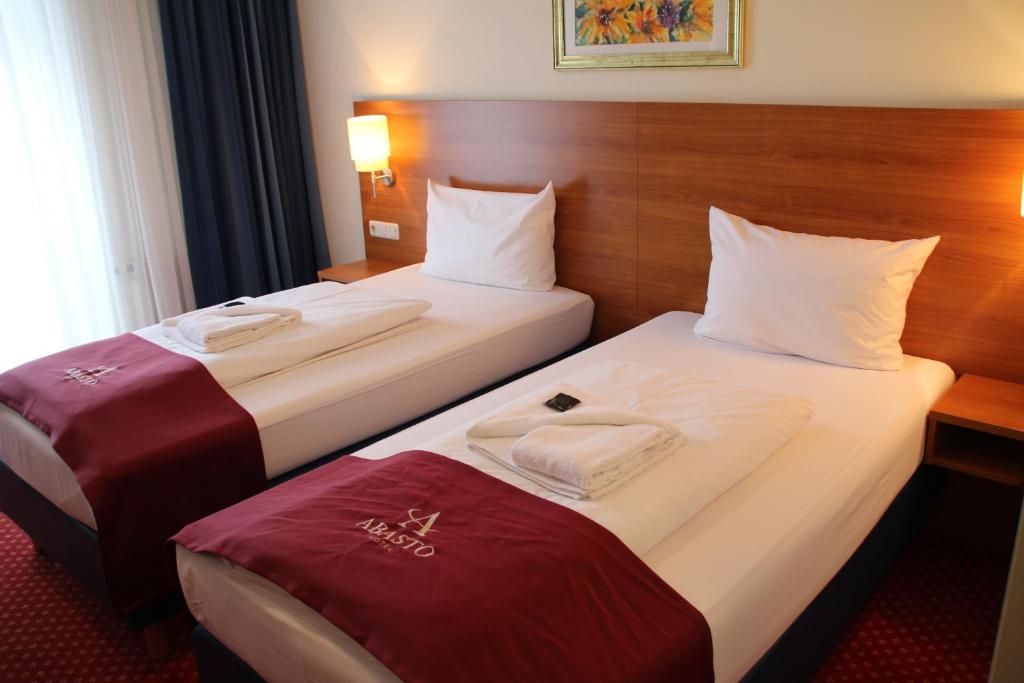 Postel nebo postele na pokoji v ubytování Abasto Hotel Eichenau