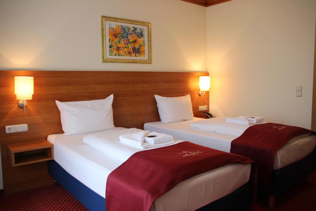 Postel nebo postele na pokoji v ubytování Abasto Hotel Eichenau