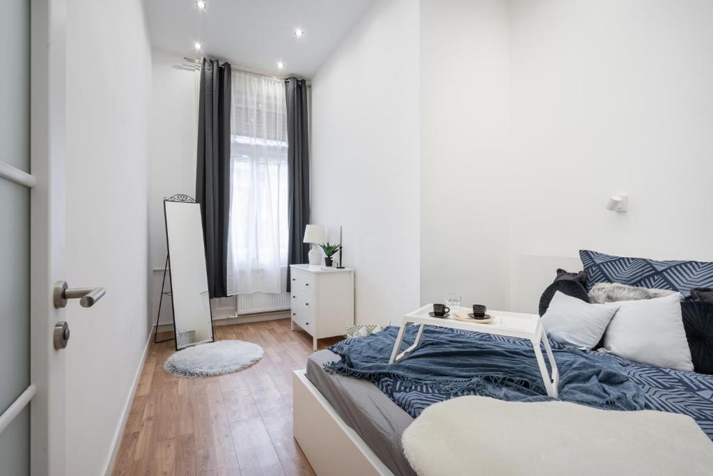 A bed or beds in a room at Budapest Eye Residence