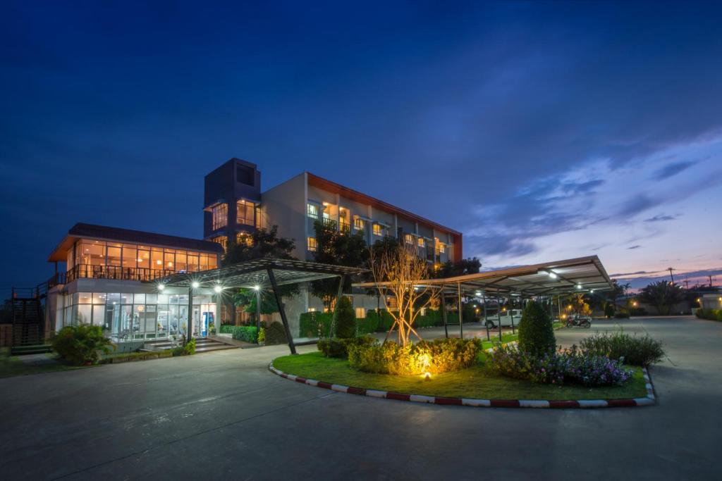 a large building with a lot of lights in front of it at Uou Hotel in Kabin Buri