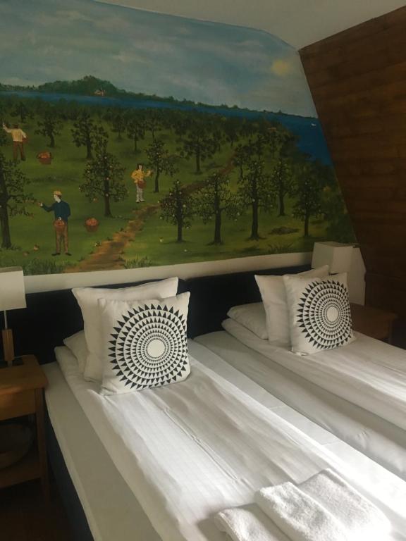 Postel nebo postele na pokoji v ubytování Bykrogen